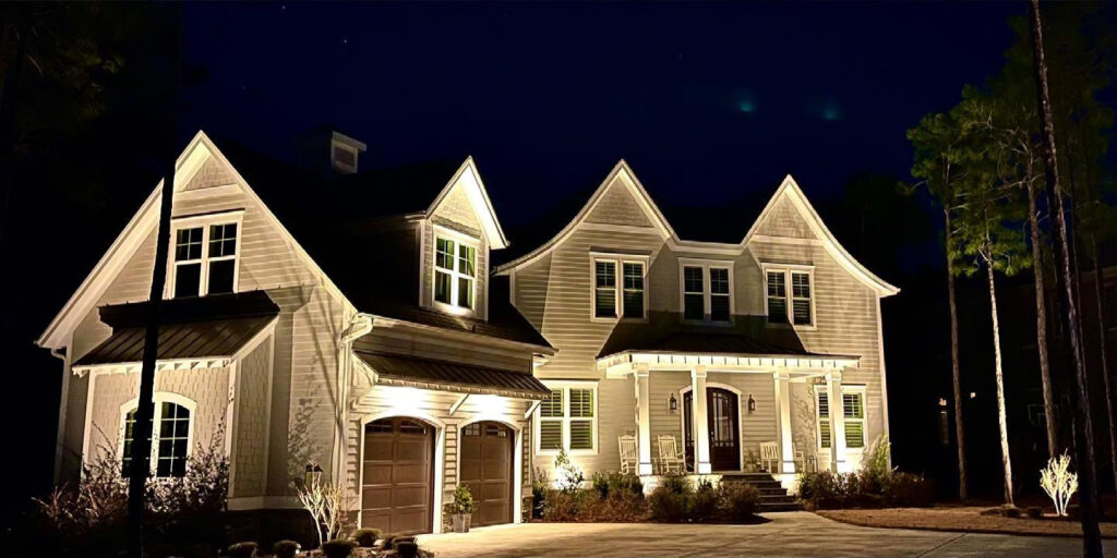 beautiful house with outdoor lighting